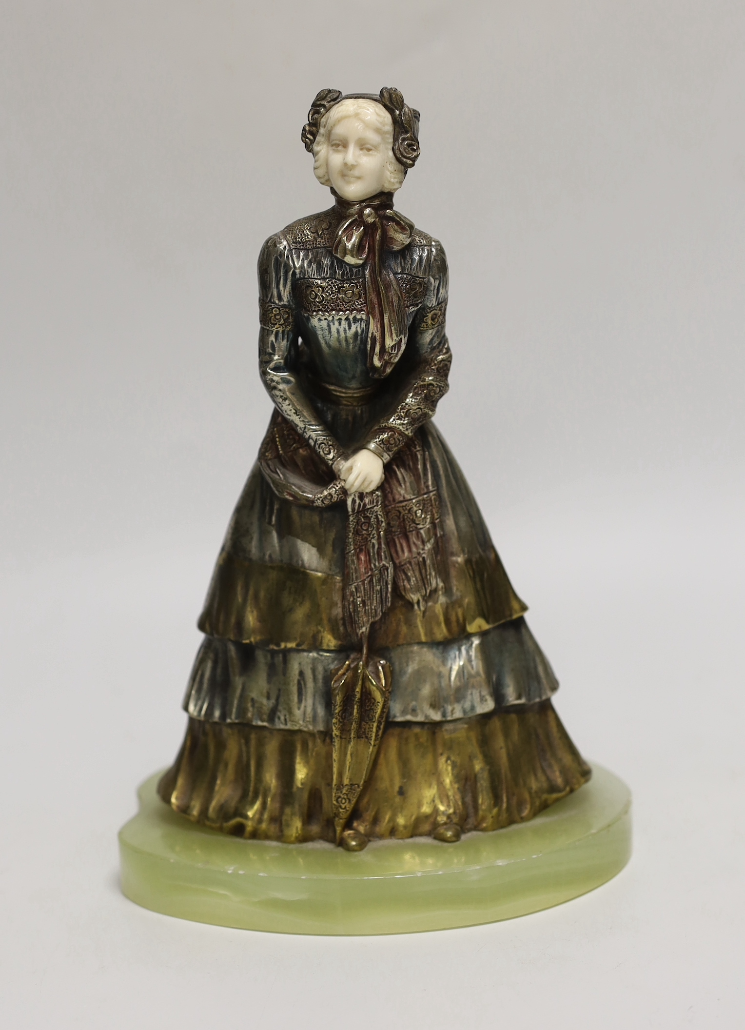 After Rene-Paul Marquet (French, 1875-1939). A bronze and ivory figure of a lady, on onyx plinth, 24cm